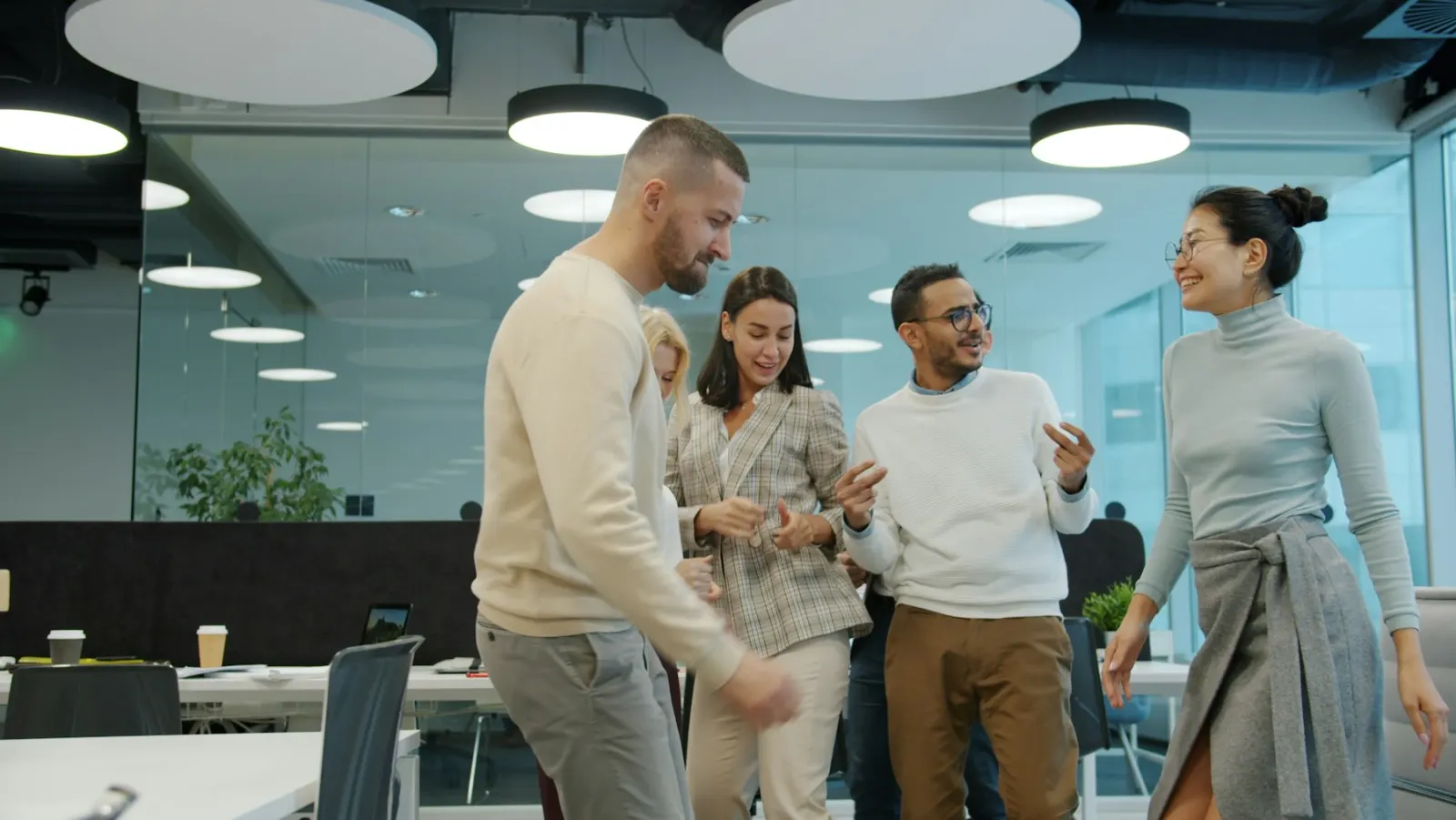 Colleagues laughing together at a work event